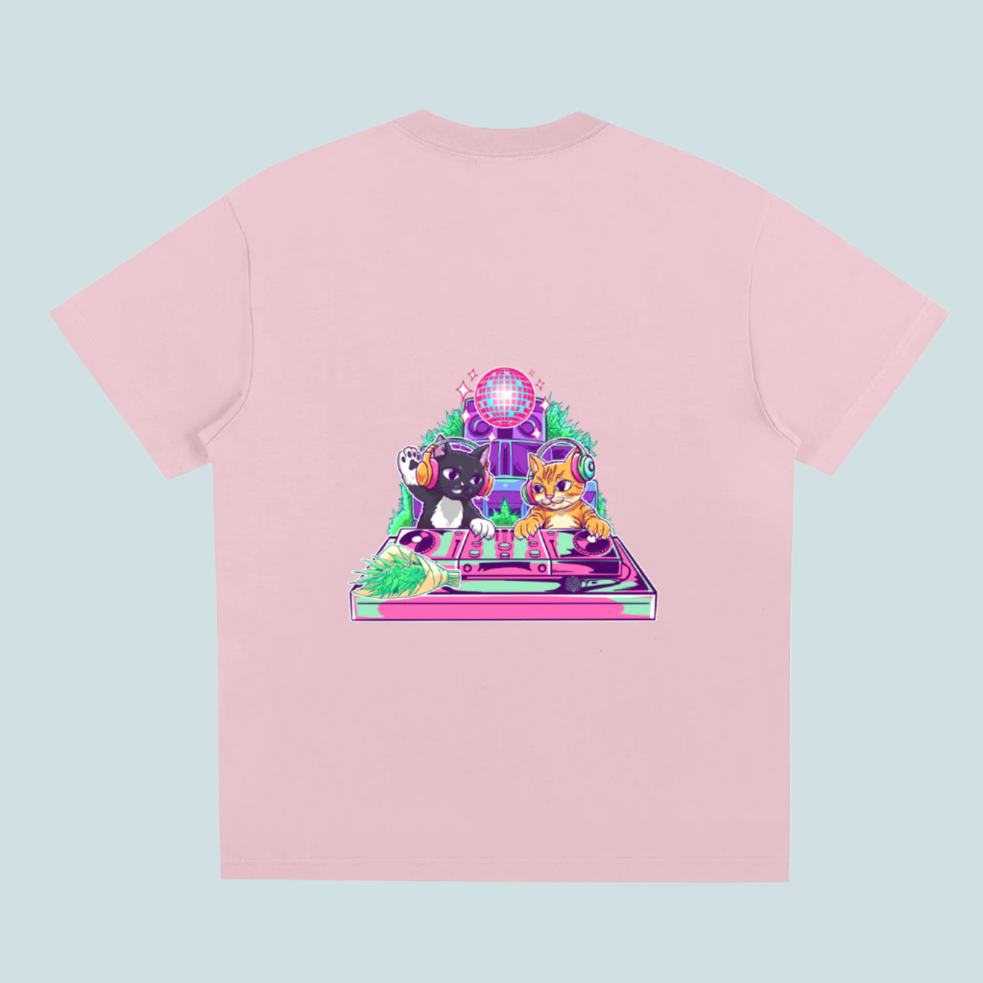 Pink t-shirt with a colorful graphic of two cats on a turntable and disco ball on a white background