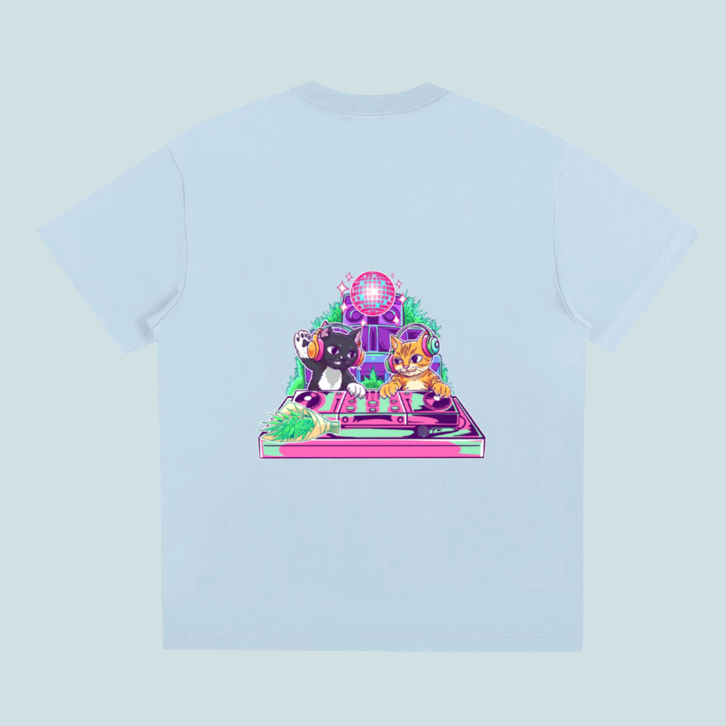 Light blue t-shirt with a colorful graphic of two cats on a turntable and disco ball.